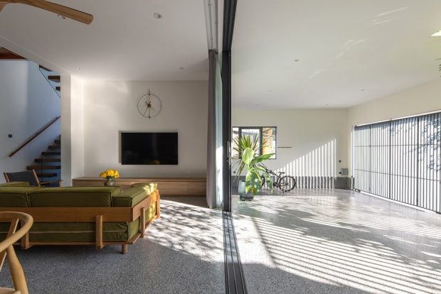 A sliding door connects the terrace to the living room.