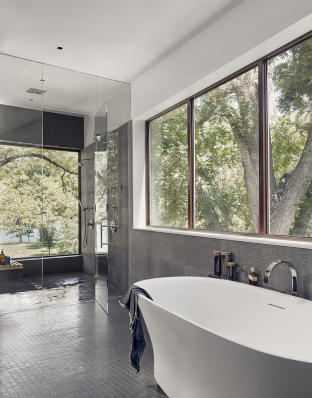 The glass-walled shower room offers panoramic views.